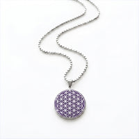 Purple and silver Flower of Life stainless steel charm necklace on a white background