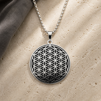 Black and silver Flower of Life charm necklace on ivory stone