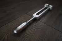 Handcrafted Tibetan singing bowl with wooden striker for sound healing, meditation, and mindfulness
