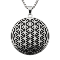 Black and silver Flower of Life stainless steel charm necklace on a white background