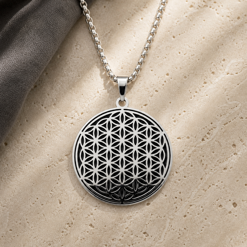 Black and silver Flower of Life charm necklace on ivory stone