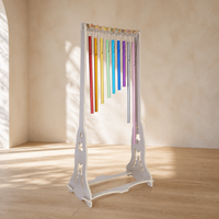 Harmony Chime Stand with nine Solfeggio chimes in a sunlit studio