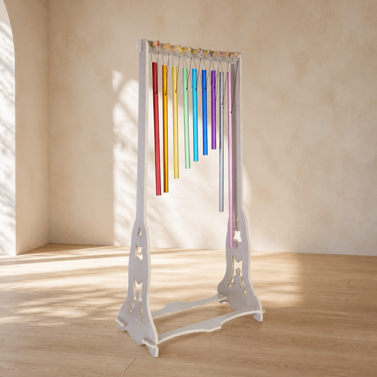 Harmony Chime Stand with nine Solfeggio chimes in a sunlit studio