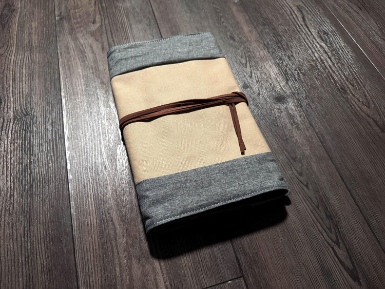 a folded piece of cloth sitting on top of a wooden floor