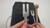 3-piece Angel Tuners sound healing set featuring three metal tuning forks with different frequencies, used for meditation, energy balancing, and vibrational therapy.