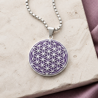 Purple and silver Flower of Life charm necklace premium close-up on ivory stone