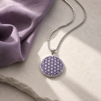 Purple and silver Flower of Life charm necklace on stone and plum linen
