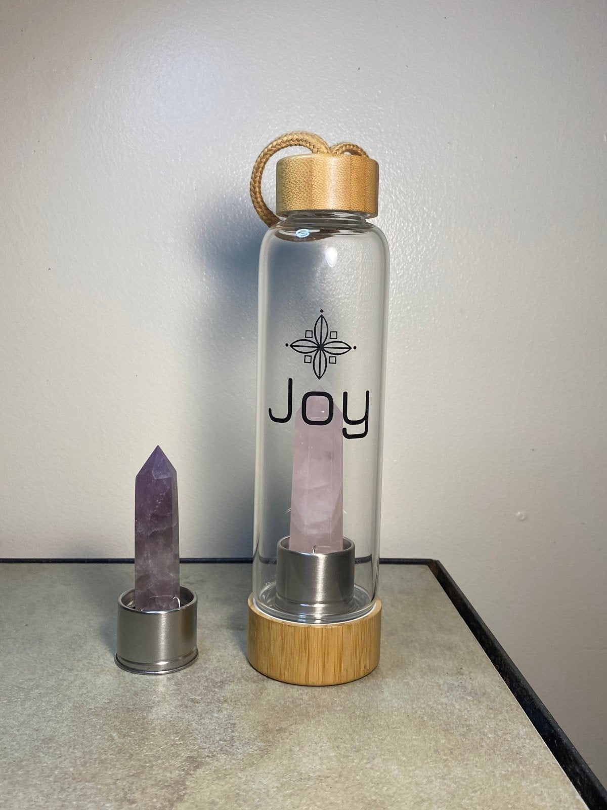 JOY Crystal Infused Borosilicate Glass Water Bottle Healing Rose Quartz And Amethyst Wand Point Inserts with Bamboo Lid and Base - Myriad Melodies